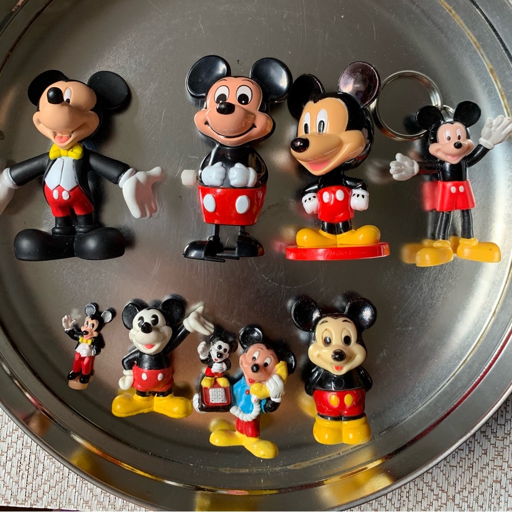 Disney Mickey figures and a tin clock box